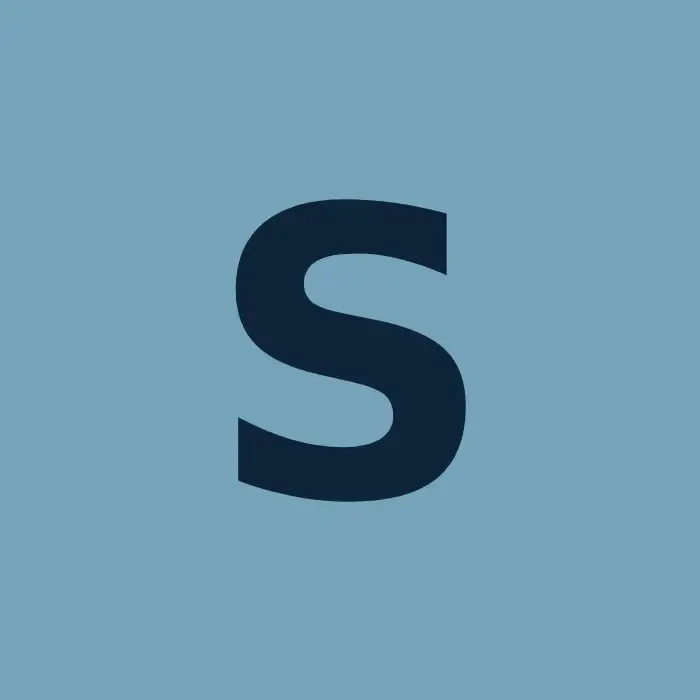 Bold dark blue letter S on a square light blue background tile. Bold dark blue letter S on a square light blue background tile.